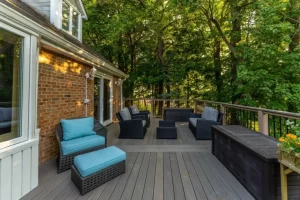 Custom composite deck lounge with black railing and built-in storage
