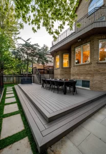 Raised composite deck with outdoor dining area and black railing